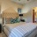 Bedroom with a doorway to a private bathroom